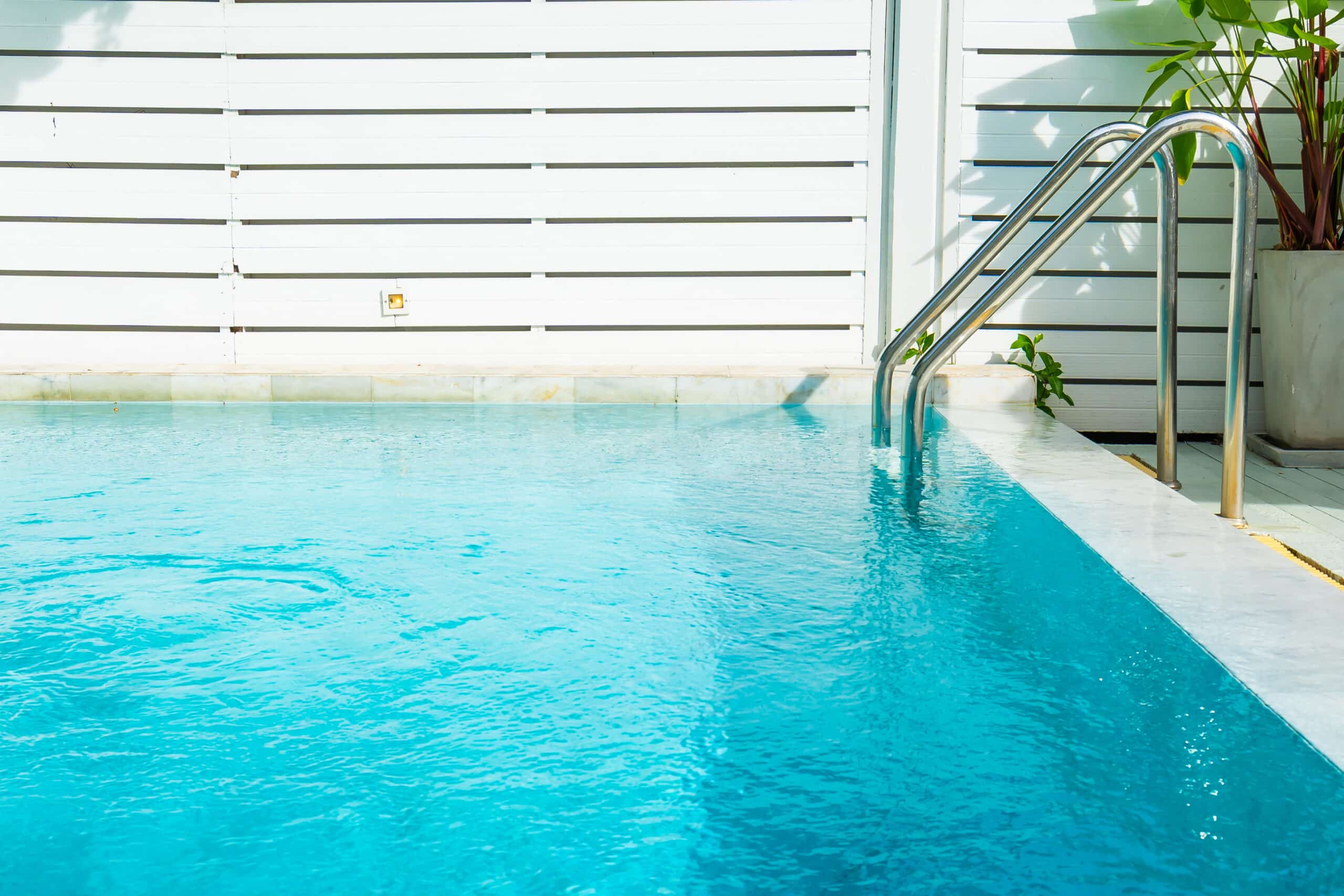 Beautiful outdoor swimming pool in hotel resort with stair